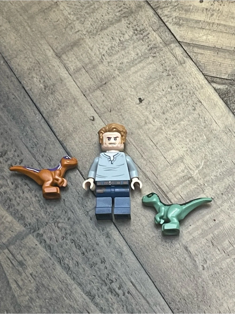 LEGO Jurassic World Owen Grady minifigure alongside baby raptor figures